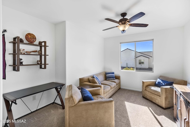 carpeted living room featuring ceiling fan