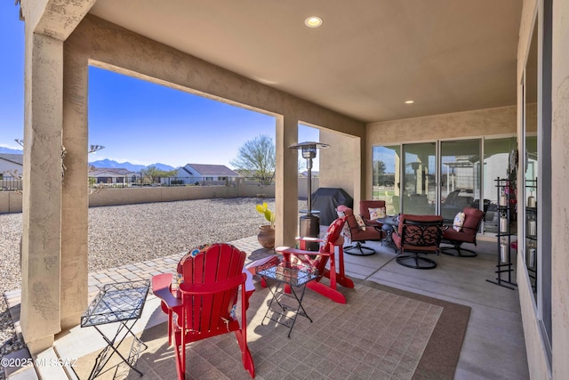 view of patio / terrace featuring a mountain view