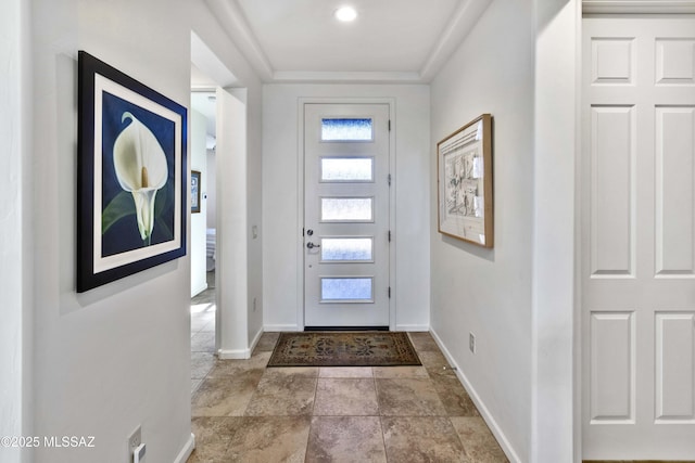 foyer featuring crown molding