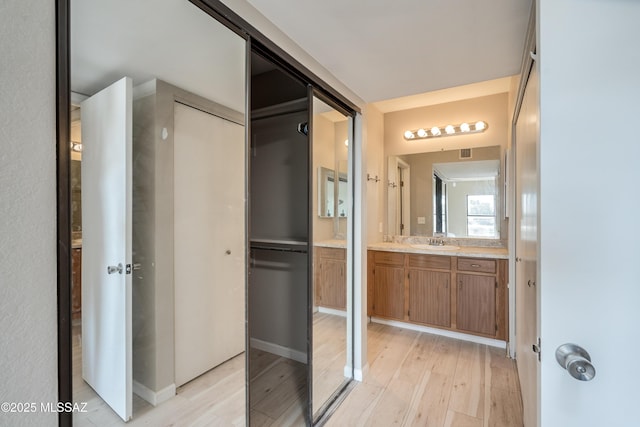 bathroom featuring vanity and hardwood / wood-style floors