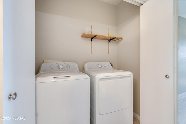 washroom featuring independent washer and dryer