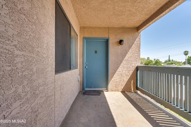 property entrance with a balcony