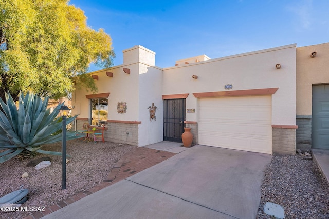 southwest-style home with a garage