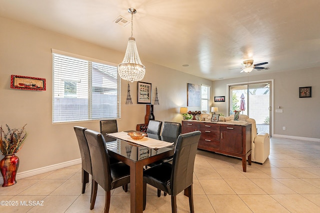 dining area with light tile patterned flooring and ceiling fan