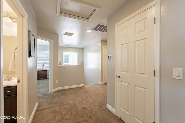 corridor featuring carpet floors