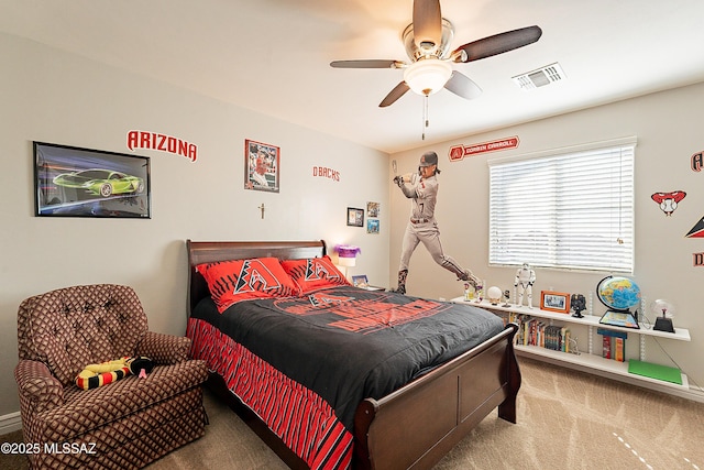 bedroom featuring ceiling fan and light carpet