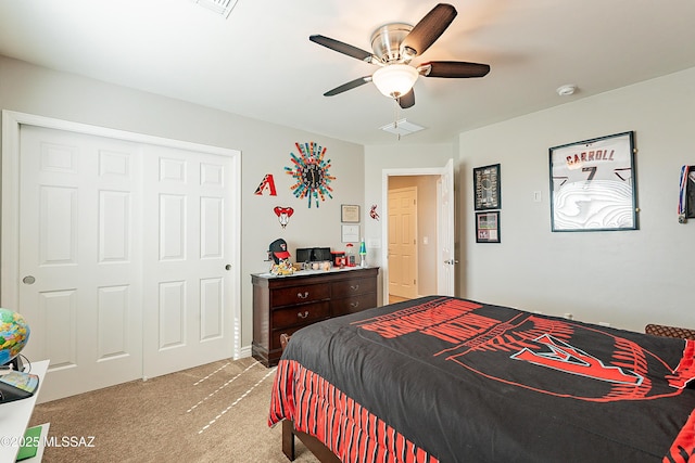 bedroom featuring light carpet, a closet, and ceiling fan