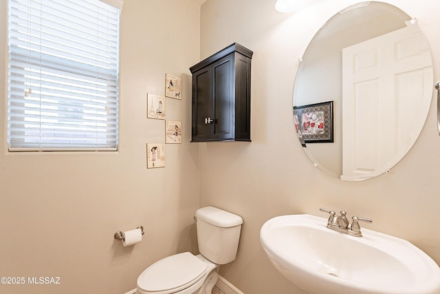 bathroom featuring sink and toilet