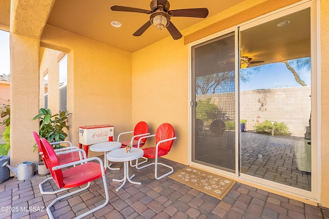 view of patio / terrace featuring ceiling fan