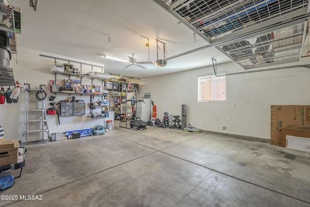 garage featuring a garage door opener and a workshop area