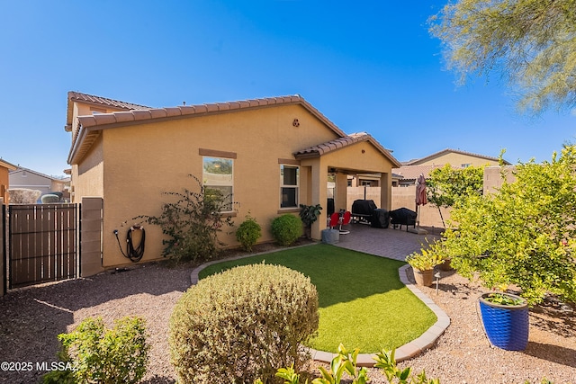 back of property with a patio area