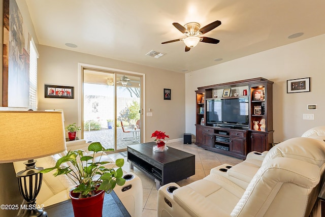 tiled living room with ceiling fan