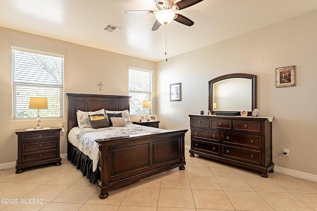 tiled bedroom with vaulted ceiling and ceiling fan