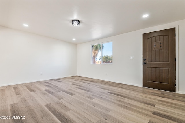 empty room with light hardwood / wood-style floors