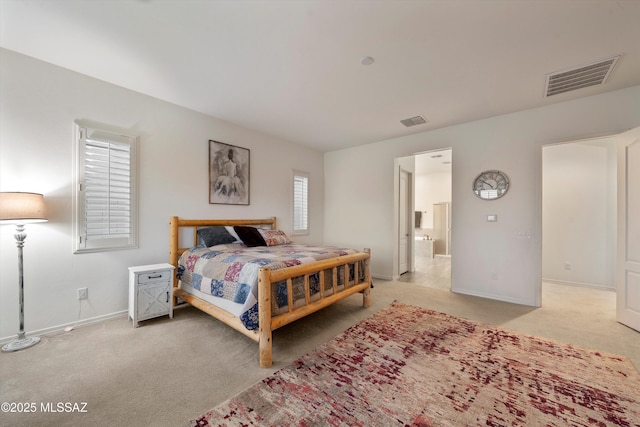 bedroom featuring light colored carpet