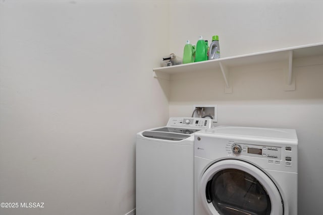 laundry room with laundry area and washing machine and clothes dryer