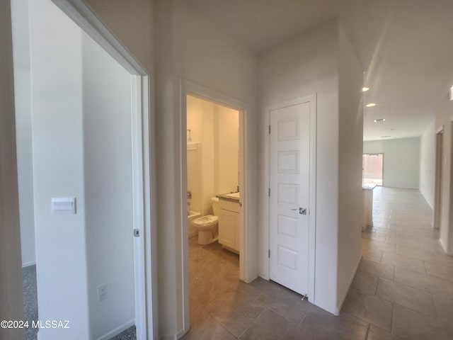 hallway featuring tile patterned floors