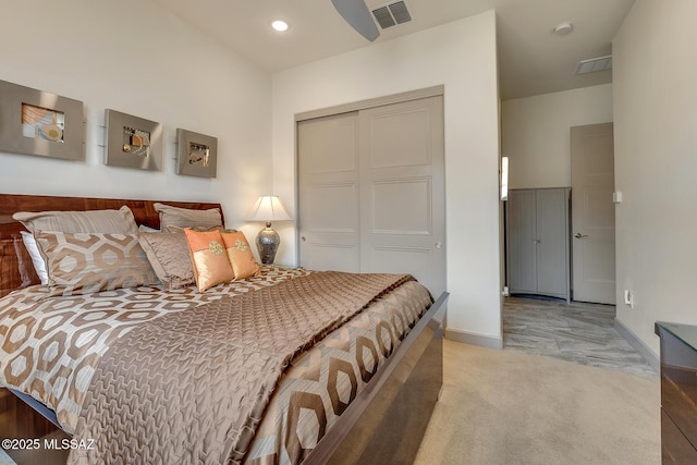 bedroom featuring recessed lighting, a closet, visible vents, light carpet, and baseboards