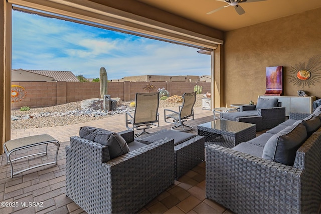 view of patio with outdoor lounge area, ceiling fan, and a fenced backyard