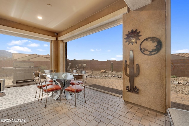 view of patio / terrace featuring outdoor dining space and a fenced backyard