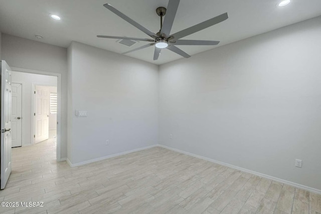 unfurnished room with ceiling fan and light hardwood / wood-style floors