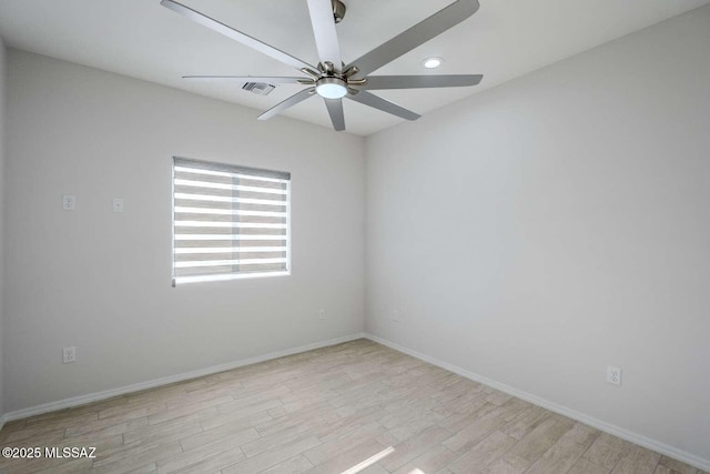 unfurnished room featuring ceiling fan and light wood-type flooring