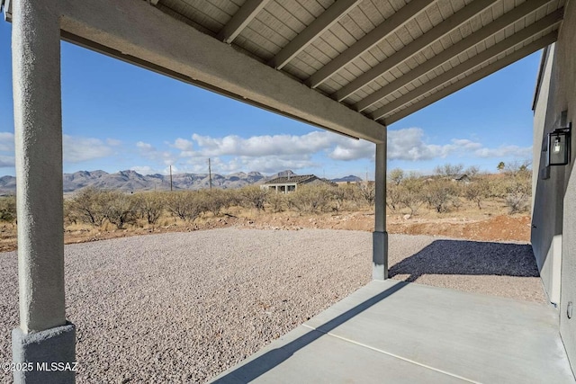 view of patio / terrace with a mountain view