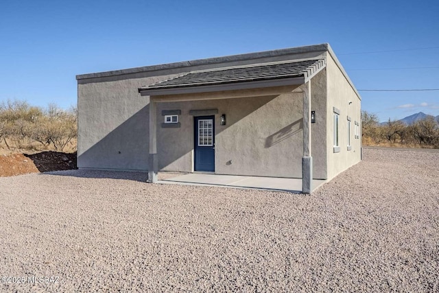 rear view of property with a patio area