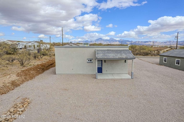 view of outbuilding with a mountain view