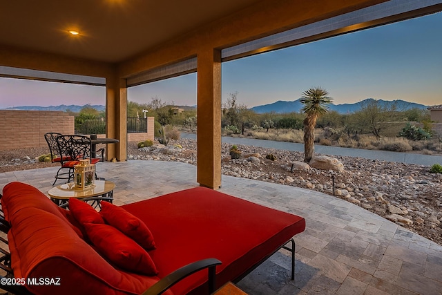 patio terrace at dusk with a mountain view