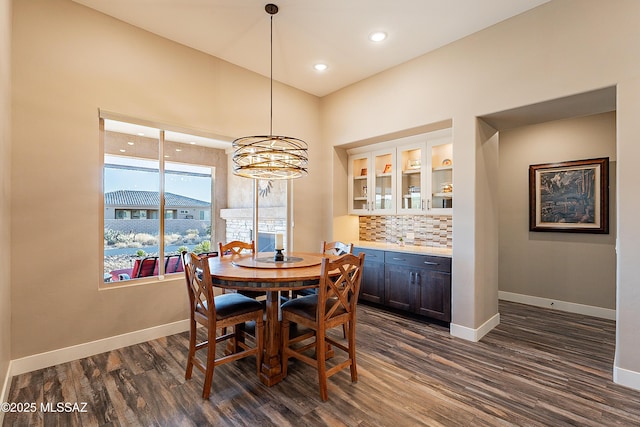 dining area with dark hardwood / wood-style flooring