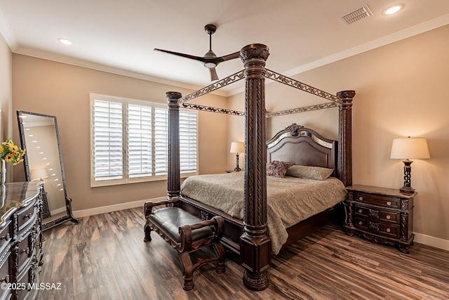 bedroom featuring hardwood / wood-style floors, ornamental molding, and ceiling fan