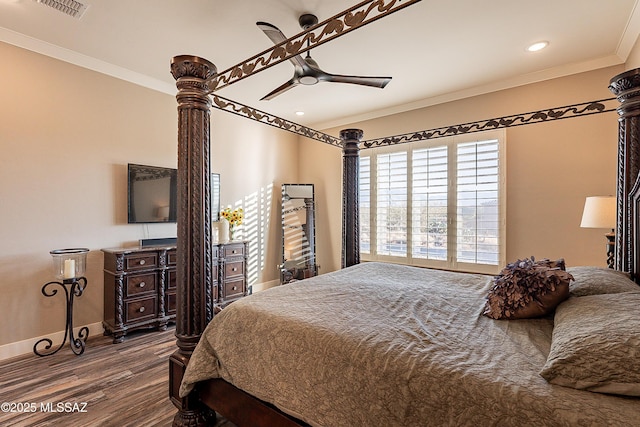 bedroom with crown molding, wood-type flooring, and ceiling fan