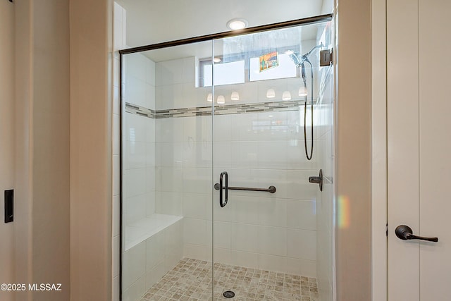 bathroom featuring an enclosed shower