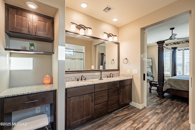 bathroom featuring vanity and wood-type flooring