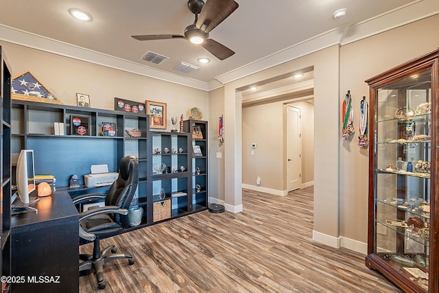 home office featuring ceiling fan, ornamental molding, and hardwood / wood-style floors