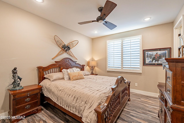 bedroom featuring dark wood-type flooring and ceiling fan