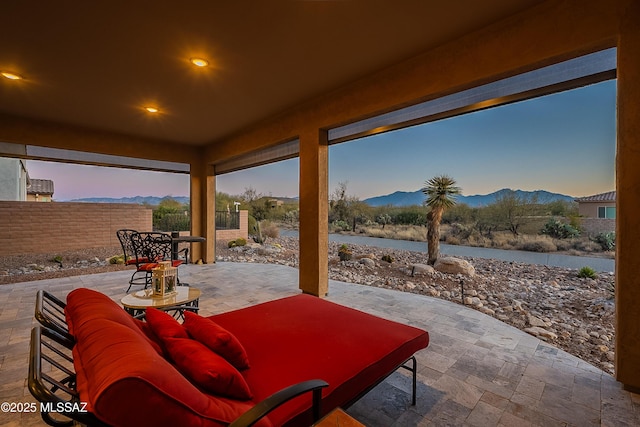 patio terrace at dusk with a mountain view