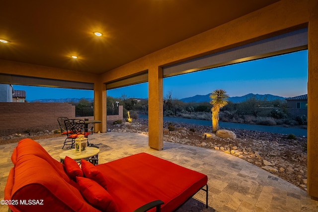 view of patio / terrace with a mountain view and outdoor lounge area