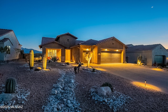 view of front of property with a garage