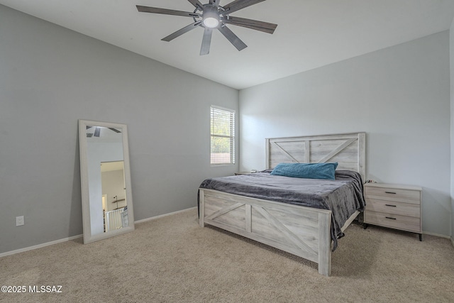 bedroom featuring light colored carpet and ceiling fan