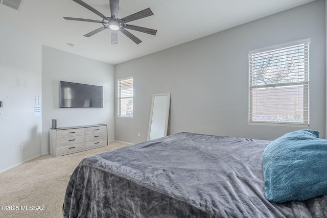 bedroom featuring ceiling fan and light carpet