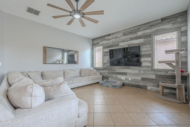 tiled living room featuring ceiling fan