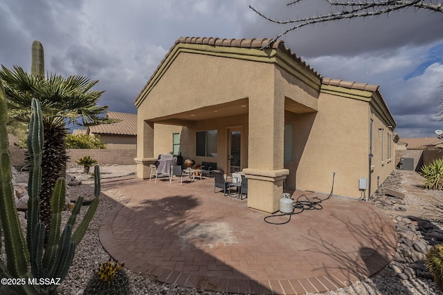 rear view of house with a patio