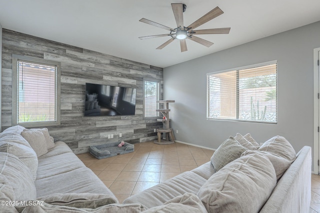 living room featuring ceiling fan and light tile patterned floors