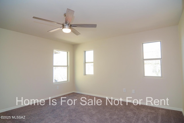 spare room featuring carpet flooring and ceiling fan