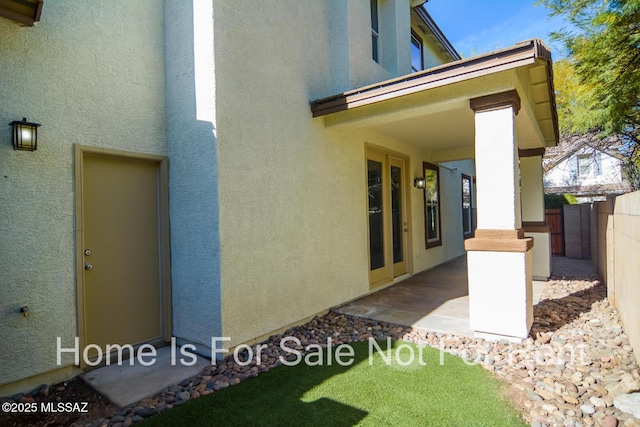 view of side of home with a patio