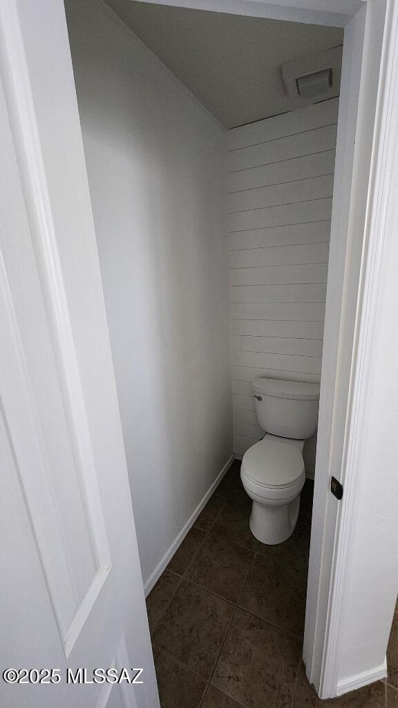 bathroom featuring tile patterned flooring and toilet