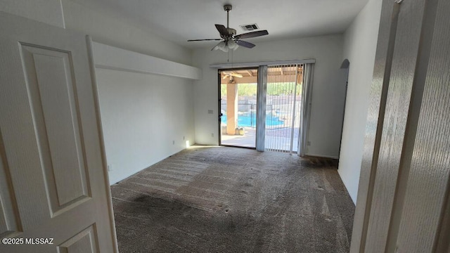 unfurnished room with carpet flooring and ceiling fan