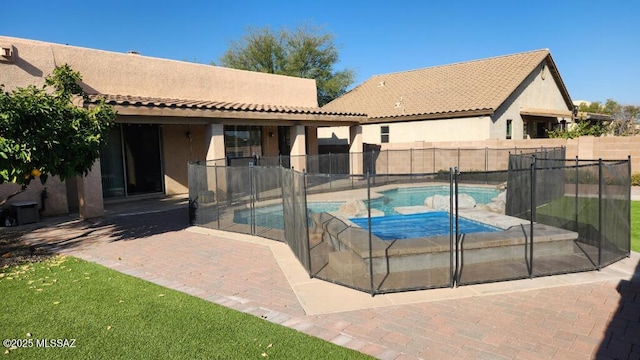 view of swimming pool featuring a patio area and a hot tub